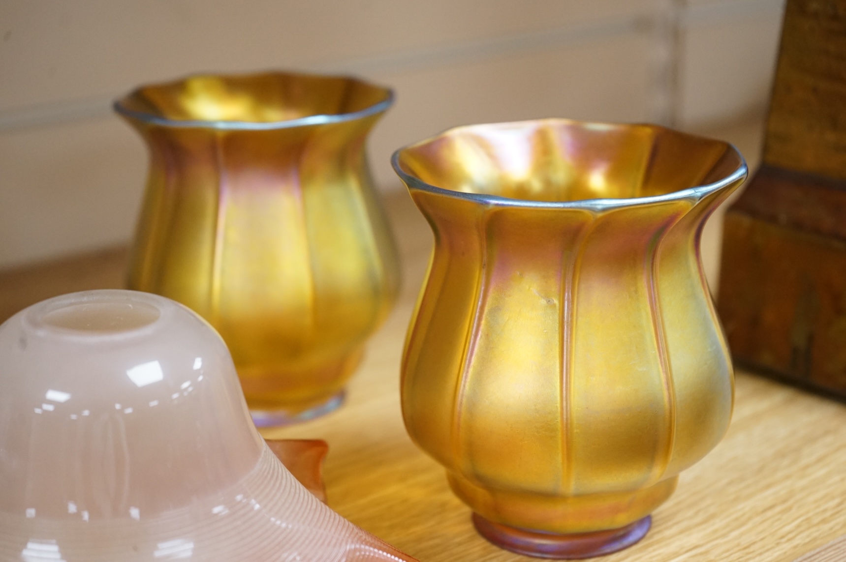 A pair of Quezal Art Glass iridescent light shades, and two frilled edged shades, Quezal shades 11.5cm high